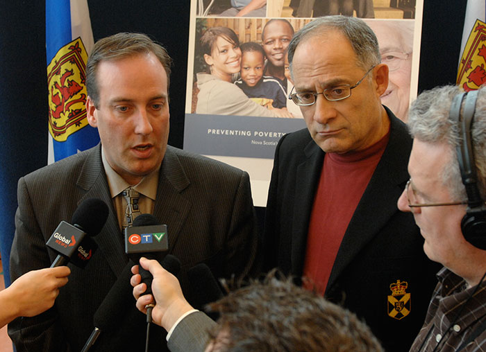 Community Services Minister Chris d'Entremont (left) and Labour and Workforce Development Minister Mark Parent take questions from media after announcing Nova Scotia's Poverty Reduction Strategy in Kentville.